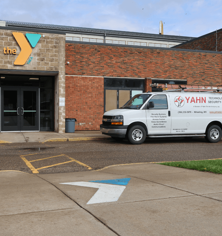 YMCA with Yahn van parked outside